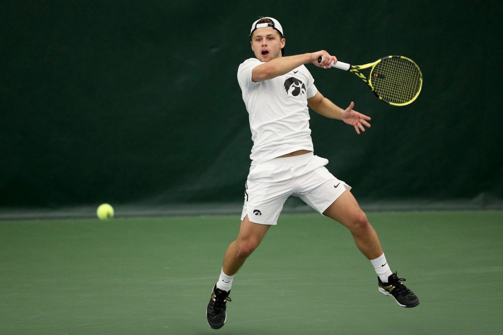 Iowa’s Will Davies against Cornell Sunday, March 8, 2020 at the Hawkeye Tennis and Recreation Center. (Brian Ray/hawkeyesports.com)
