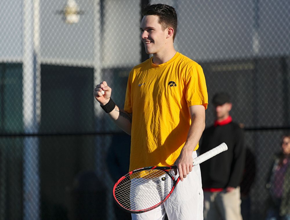 Iowa's Jonas Larsen pumps his fist as he celebrates a point during their doubles match again Michigan State at the Hawkeye Tennis and Recreation Complex in Iowa City on Friday, Apr. 19, 2019. (Stephen Mally/hawkeyesports.com)