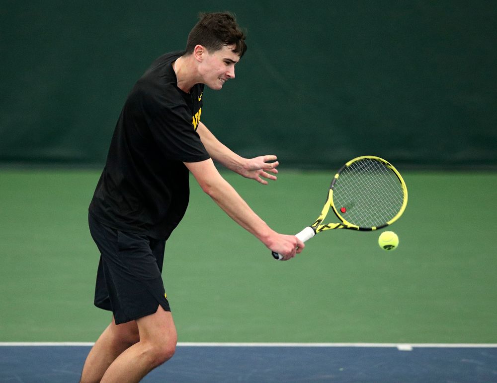 Iowa’s Matt Clegg returns a shot during his doubles match at the Hawkeye Tennis and Recreation Complex in Iowa City on Friday, March 6, 2020. (Stephen Mally/hawkeyesports.com)