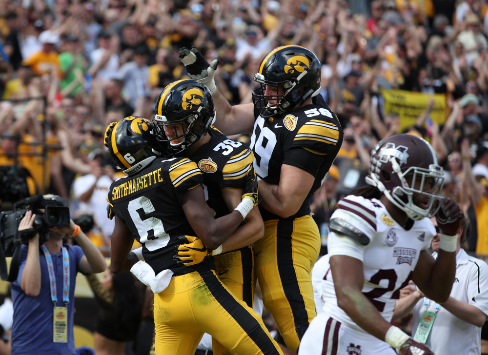 Iowa Hawkeyes wide receiver Ihmir Smith-Marsette (6), tight end T.J. Hockenson (38), and offensive lineman Ross Reynolds (59) during their Outback Bowl Tuesday, January 1, 2019 at Raymond James Stadium in Tampa, FL. (Brian Ray/hawkeyesports.com)