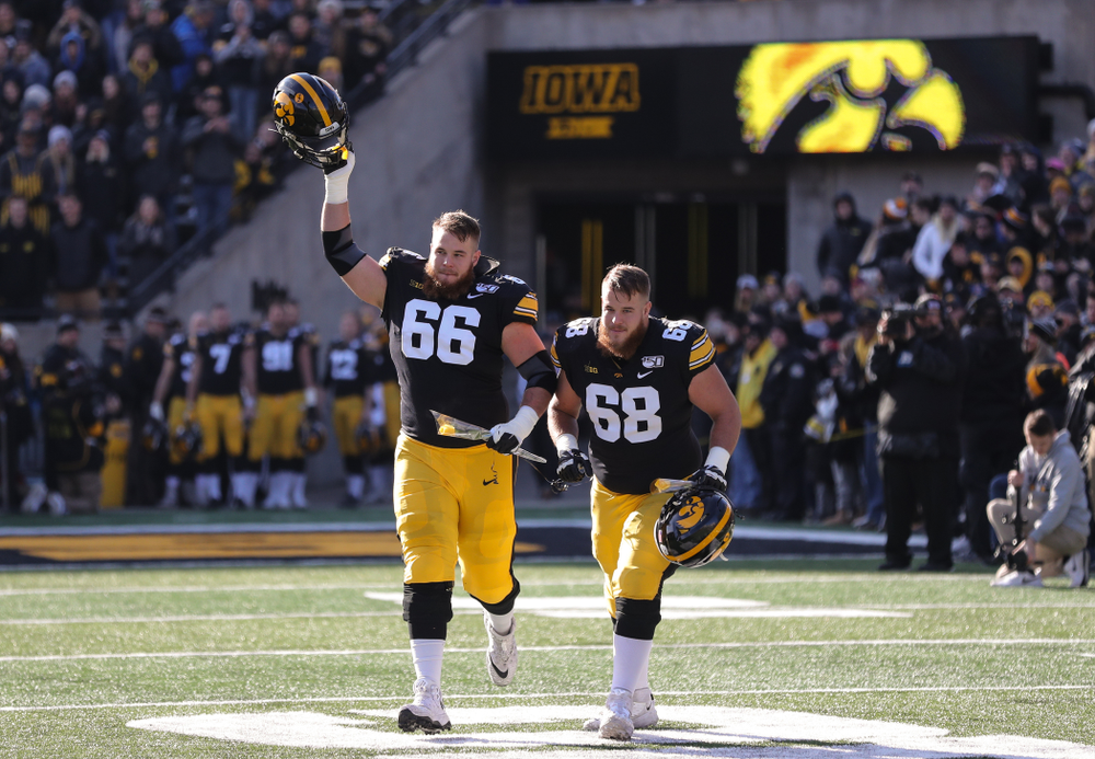 Iowa Hawkeyes offensive lineman Landan Paulsen (68) and offensive lineman Levi Paulsen (66) during Senior Day festivities before their game against the Illinois Fighting Illini Saturday, November 23, 2019 at Kinnick Stadium. (Brian Ray/hawkeyesports.com)