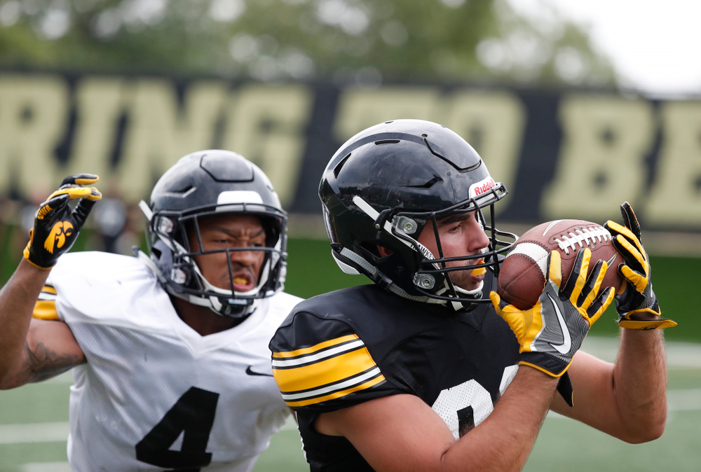 Iowa Hawkeyes wide receiver Nico Ragaini (89) and defensive back Josh Turner (4) during practice No. 4 of Fall Camp Monday, August 6, 2018 at the Hansen Football Performance Center. (Brian Ray/hawkeyesports.com)