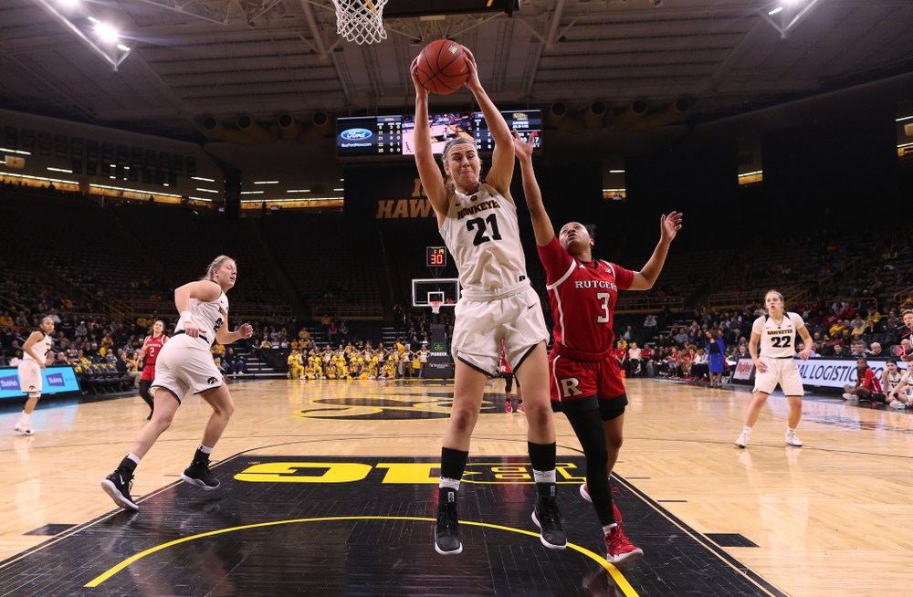 Iowa Hawkeyes forward Hannah Stewart (21) grabs a rebound against the Rutgers Scarlet Knights Wednesday, January 23, 2019 at Carver-Hawkeye Arena. (Brian Ray/hawkeyesports.com)