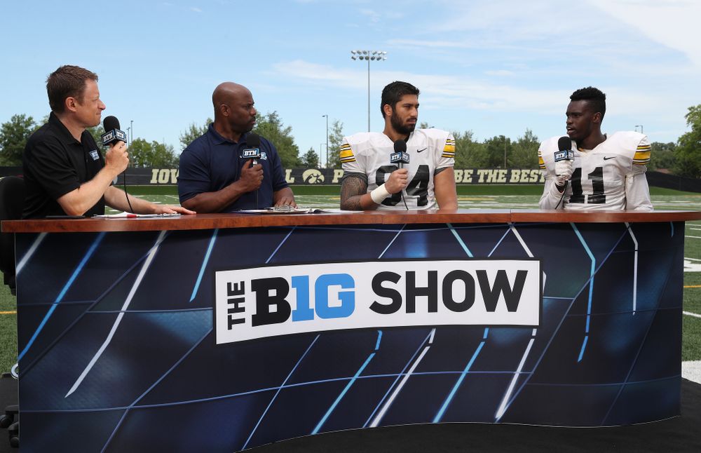 Iowa Hawkeyes defensive end A.J. Epenesa (94) and defensive back Michael Ojemudia (11) on the set of the BTN Tailgate Tour following fall camp Practice No. 16 Tuesday, August 20, 2019 at the Ronald D. and Margaret L. Kenyon Football Practice Facility. (Brian Ray/hawkeyesports.com)
