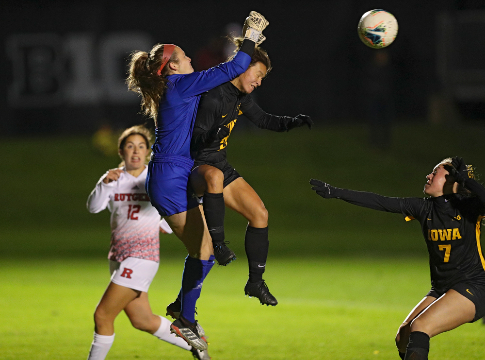 Iowa forward Emma Tokuyama (21) tries to head in a shot as forward Skylar Alward (7) looks on during the second half of their match at the Iowa Soccer Complex in Iowa City on Friday, Oct 11, 2019. (Stephen Mally/hawkeyesports.com)