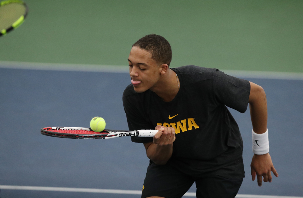 Will Davies and Oliver Okonkwo plays a doubles match against the Miami Hurricanes Friday, February 8, 2019 at the Hawkeye Tennis and Recreation Complex. (Brian Ray/hawkeyesports.com)