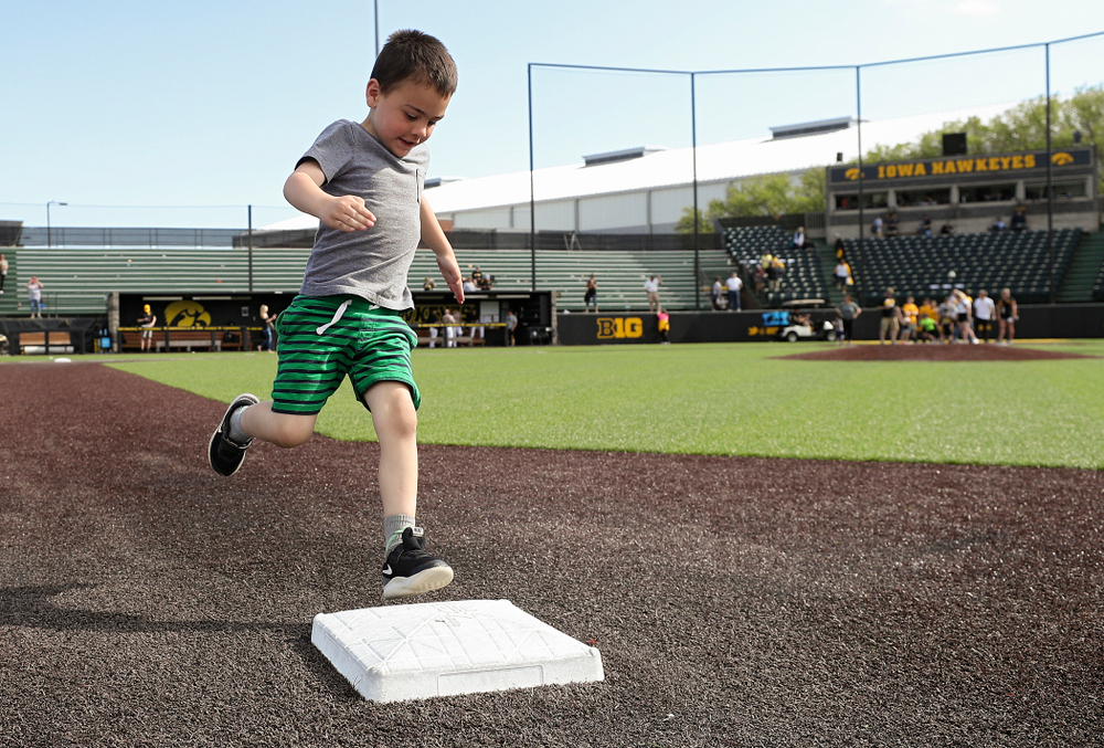Kids run the bases after Iowa's game against UC Irvine at Duane Banks Field in Iowa City on Sunday, May. 5, 2019. (Stephen Mally/hawkeyesports.com)