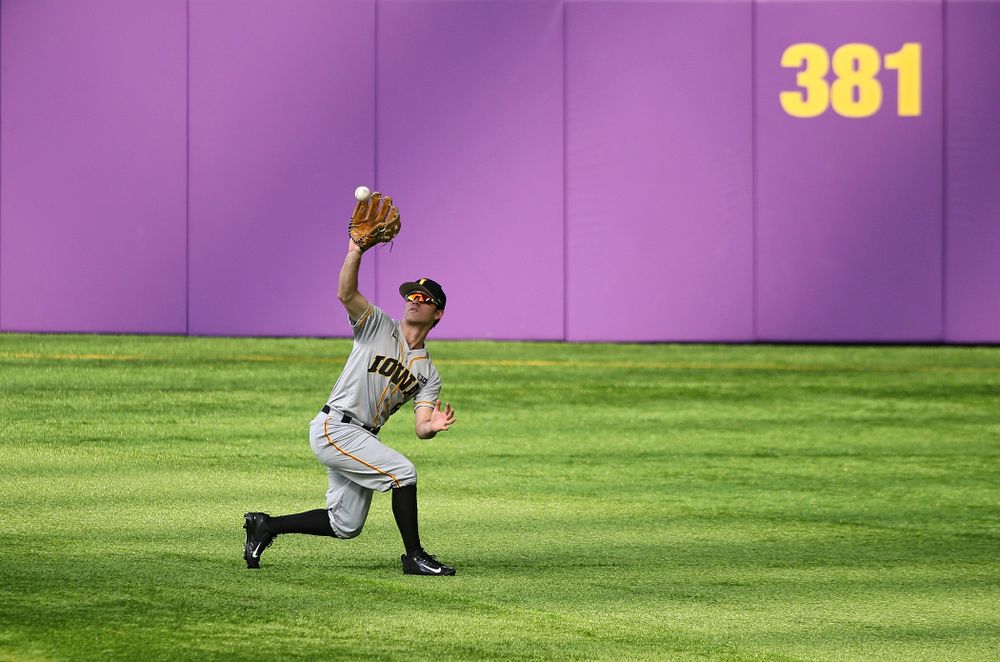 Iowa Hawkeyes outfielder Justin Jenkins (6) pulls in a fly ball for an out during the third inning of their CambriaCollegeClassic game at U.S. Bank Stadium in Minneapolis, Minn. on Friday, February 28, 2020. (Stephen Mally/hawkeyesports.com)