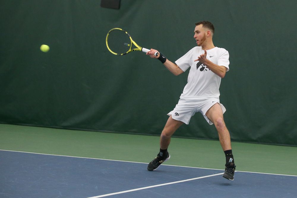 Iowa’s Kareem Allaf returns a hit during the Iowa men’s tennis meet vs Nebraska on Sunday, March 1, 2020 at the Hawkeye Tennis and Recreation Complex. (Lily Smith/hawkeyesports.com)