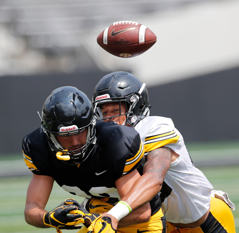 Iowa Hawkeyes wide receiver Nico Ragaini (89) and defensive back Julius Brents (20) during Kids Day Saturday, August 11, 2018 at Kinnick Stadium. (Brian Ray/hawkeyesports.com)
