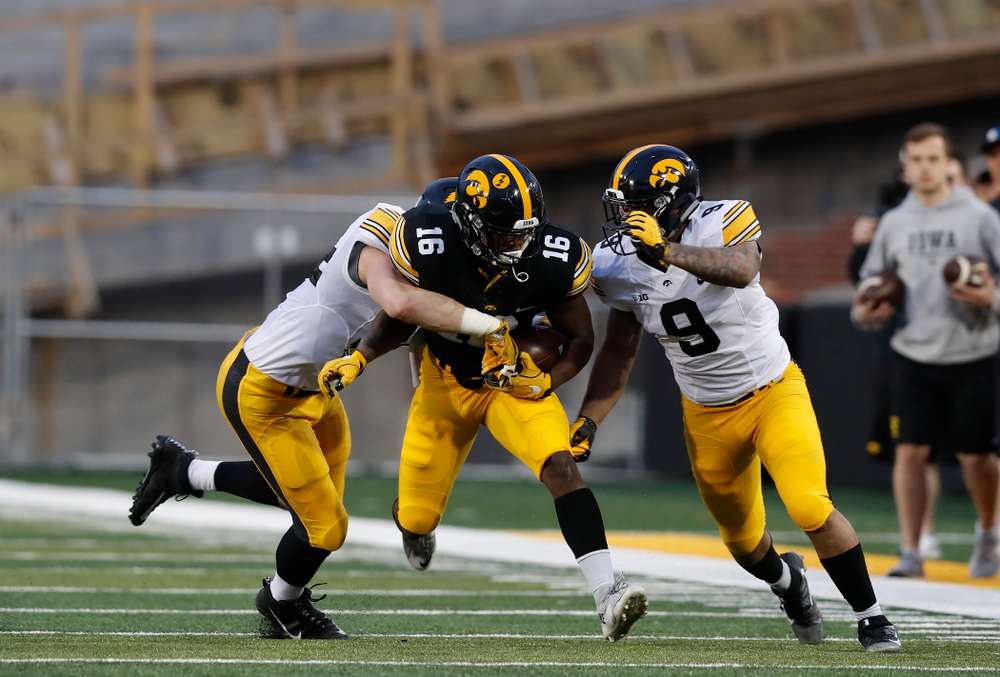 Iowa Hawkeyes running back Kyshaun Bryan (16) and defensive back Geno Stone (9) during their final spring practice Friday, April 20, 2018 at Kinnick Stadium. (Brian Ray/hawkeyesports.com)