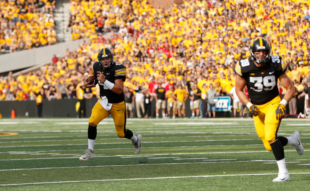 Iowa Hawkeyes quarterback Nate Stanley (4) carries the ball against the Northern Illinois Huskies Saturday, September 1, 2018 at Kinnick Stadium. (Brian Ray/hawkeyesports.com)