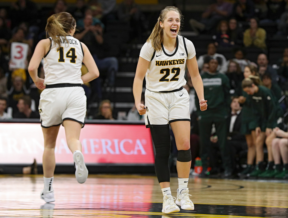 Iowa Hawkeyes guard Kathleen Doyle (22) is pumped up after guard Mckenna Warnock (14) made a 3-pointer during the fourth quarter of their game at Carver-Hawkeye Arena in Iowa City on Sunday, January 26, 2020. (Stephen Mally/hawkeyesports.com)