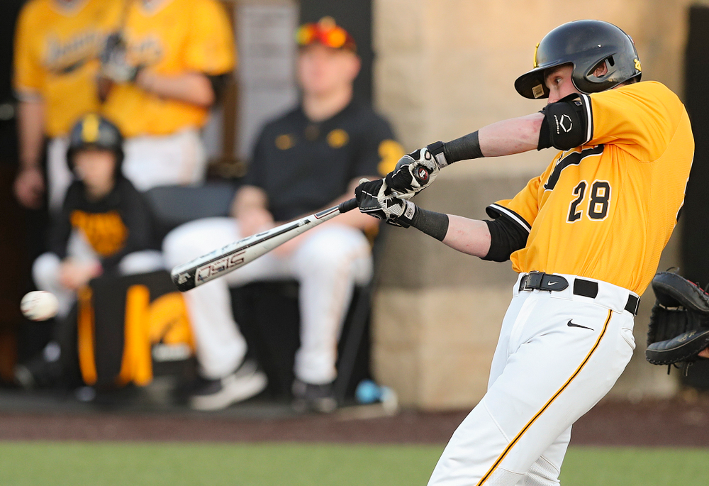 Iowa Hawkeyes left fielder Chris Whelan (28) gets a hit during the eighth inning of their game against Northern Illinois at Duane Banks Field in Iowa City on Tuesday, Apr. 16, 2019. (Stephen Mally/hawkeyesports.com)
