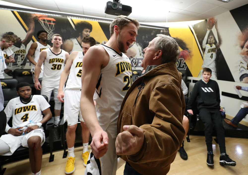 wa Hawkeyes forward Riley Till (20) chest bumps University of Iowa President Bruce Harreld following their victory over the Northwestern Wildcats Sunday, February 10, 2019 at Carver-Hawkeye Arena. (Brian Ray/hawkeyesports.com)