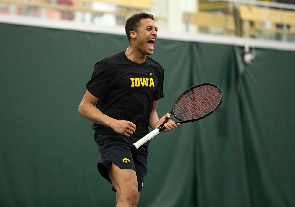 Iowa’s Oliver Okonkwo celebrates a point during his singles match at the Hawkeye Tennis and Recreation Complex in Iowa City on Friday, March 6, 2020. (Stephen Mally/hawkeyesports.com)