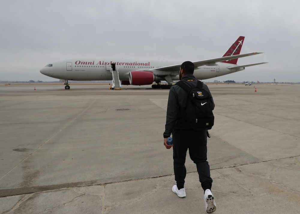 Iowa Hawkeyes running back Toren Young (28) boards the team plane Wednesday, December 26, 2018 as they travel to Tampa, Florida for the Outback Bowl. (Brian Ray/hawkeyesports.com)