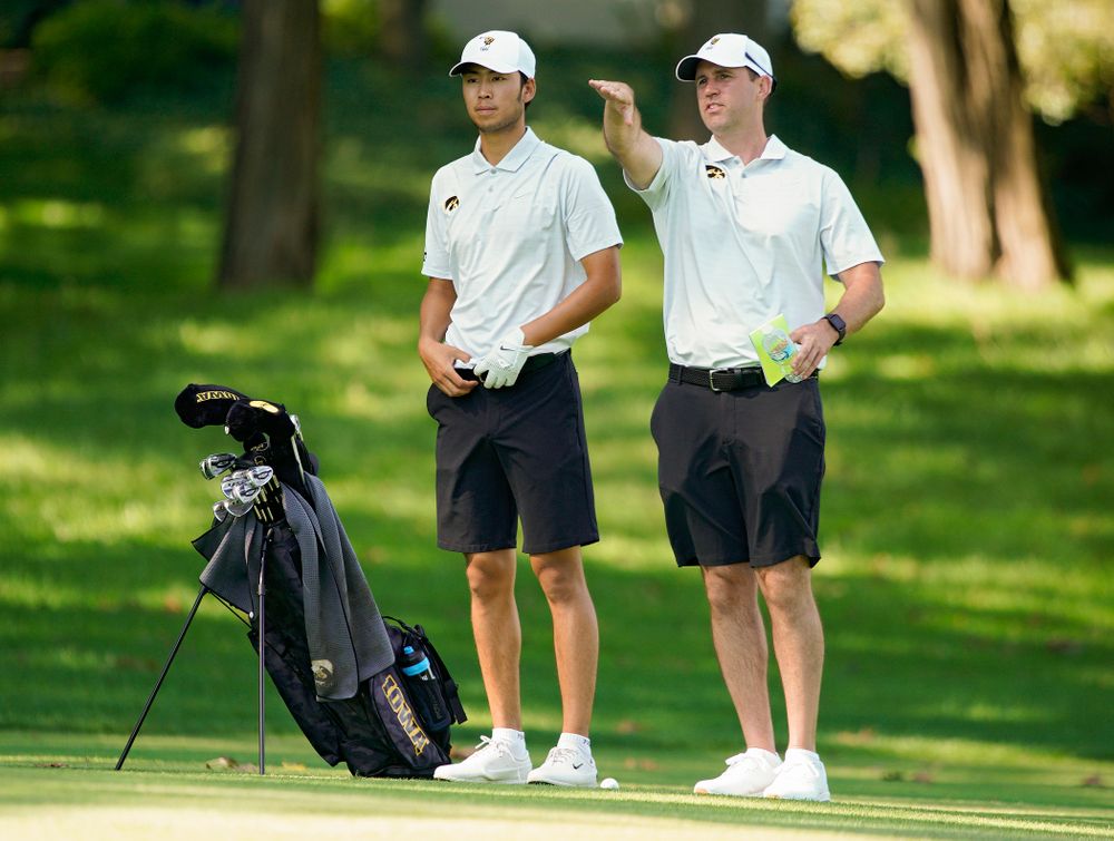 Iowa’s Joe Kim (from left) talks with head coach Tyler Stith during the second day of the Golfweek Conference Challenge at the Cedar Rapids Country Club in Cedar Rapids on Monday, Sep 16, 2019. (Stephen Mally/hawkeyesports.com)