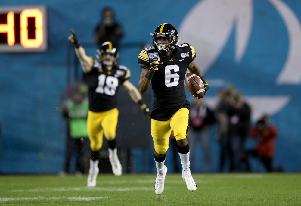 Iowa Hawkeyes wide receiver Ihmir Smith-Marsette (6) returns a kick for a touchdown against USC in the Holiday Bowl Friday, December 27, 2019 at San Diego Community Credit Union Stadium. (Brian Ray/hawkeyesports.com)
