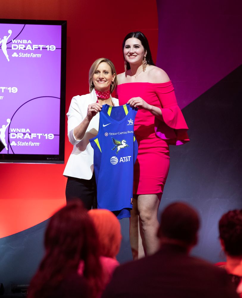 Iowa Hawkeyes forward Megan Gustafson (10) holds up a jersey after being selected by the Dallas Wings in the second round of the 2019 WNBA Draft Wednesday, April 10, 2019 at Nike New York Headquarters in New York City. (Brian Ray/hawkeyesports.com)