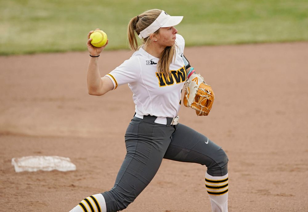Iowa Hawkeyes Sydney Owens (5) throws to first base for an out during the sixth inning of their Big Ten Conference softball game at Pearl Field in Iowa City on Friday, Mar. 29, 2019. (Stephen Mally/hawkeyesports.com)