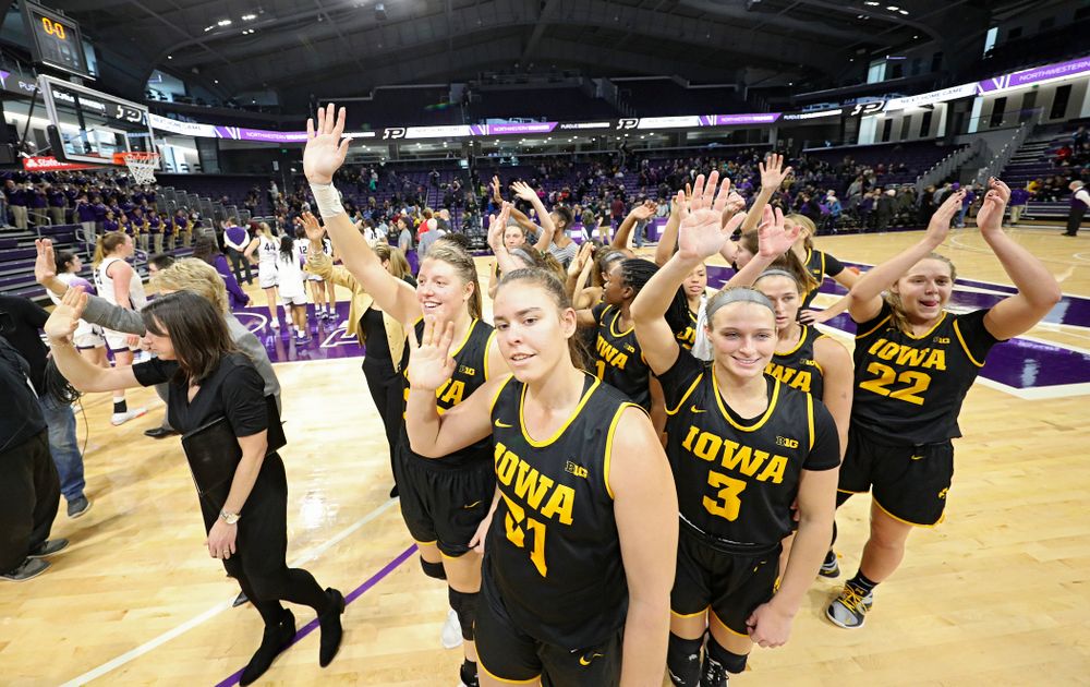 The Hawkeyes wave to their fans after winning their game at Welsh-Ryan Arena in Evanston, Ill. on Sunday, January 5, 2020. (Stephen Mally/hawkeyesports.com)