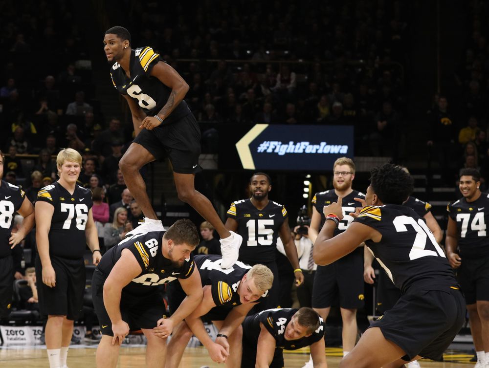 The Iowa Dance Team performs with the Iowa Football Team at halftime of the Iowa Hawkeyes game against the Indiana Hoosiers Friday, February 22, 2019 at Carver-Hawkeye Arena. (Brian Ray/hawkeyesports.com)