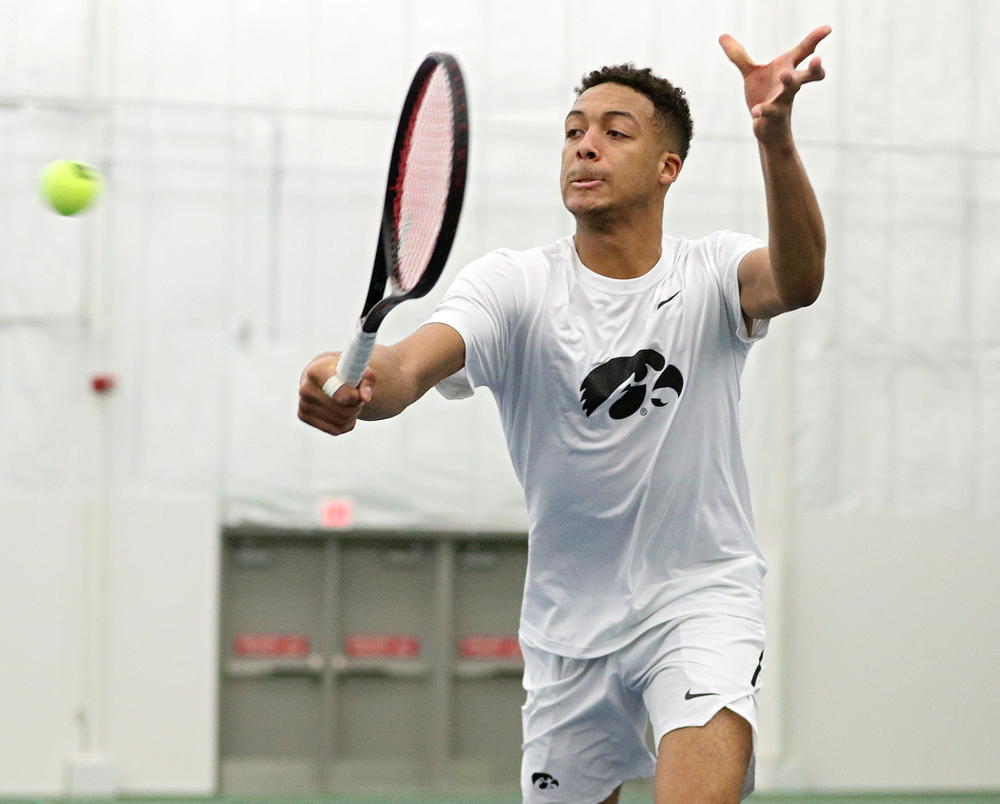 Iowa’s Oliver Okonkwo returns a shot during his doubles match at the Hawkeye Tennis and Recreation Complex in Iowa City on Sunday, February 16, 2020. (Stephen Mally/hawkeyesports.com)
