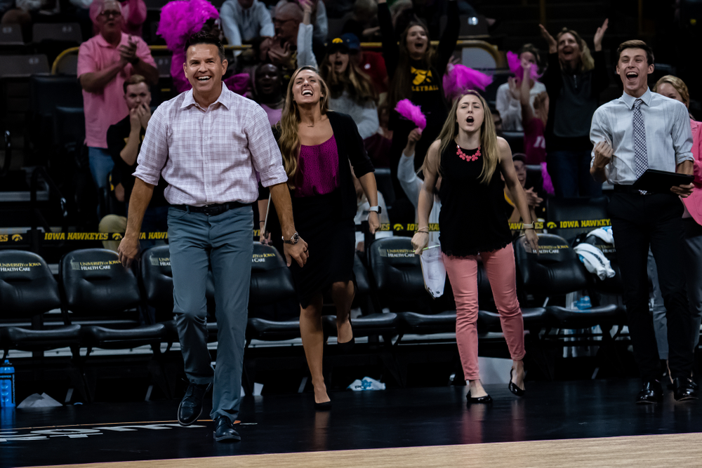 Iowa Hawkeyes head coach Bond Shymansky and director of volleyball operations Emily Sparks against the Wisconsin Badgers Saturday, October 6, 2018 at Carver-Hawkeye Arena. (Clem Messerli/Iowa Sports Pictures)