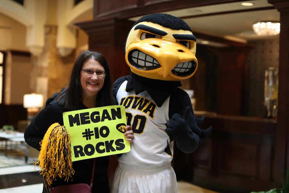 Eva Gustafson and Herky during a send off at the hotel before their game against the NC State Wolfpack in the regional semi-final of the 2019 NCAA Women's College Basketball Tournament Saturday, March 30, 2019 at Greensboro Coliseum in Greensboro, NC.(Brian Ray/hawkeyesports.com)