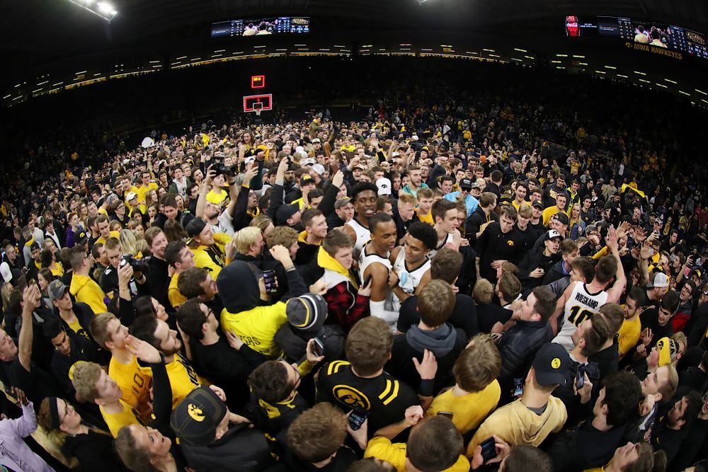 Fans storm the court after Iowa Hawkeyes defeated the Michigan Wolverines Friday, February 1, 2019 at Carver-Hawkeye Arena. (Brian Ray/hawkeyesports.com)