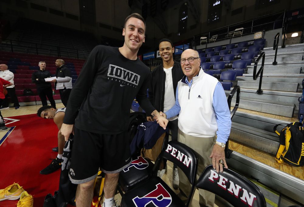 Iowa Hawkeyes guard Connor McCaffery (30) takes a photo with Bob Weinhauer, Fran McCafferyÕs head coach at Penn, before practice at the Palestra Friday, January 3, 2020 in Philadelphia. (Brian Ray/hawkeyesports.com)