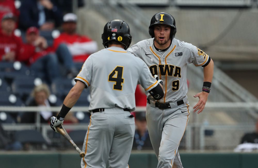 Iowa Hawkeyes outfielder Ben Norman (9) scores against the Indiana Hoosiers in the first round of the Big Ten Baseball Tournament Wednesday, May 22, 2019 at TD Ameritrade Park in Omaha, Neb. (Brian Ray/hawkeyesports.com)