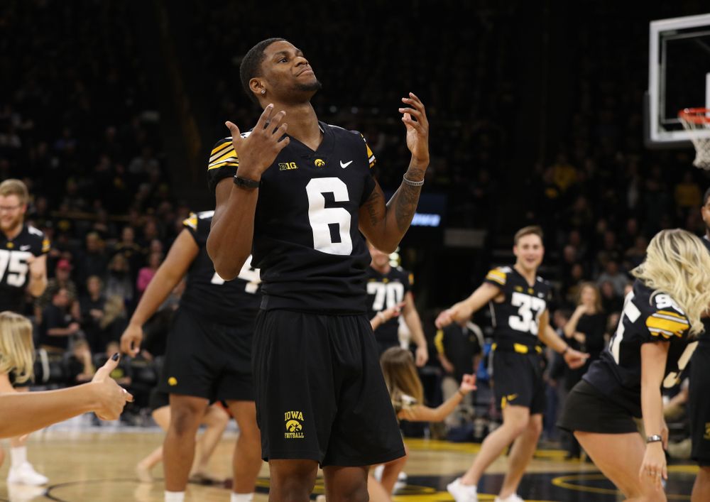 The Iowa Dance Team performs with the Iowa Football Team at halftime of the Iowa Hawkeyes game against the Indiana Hoosiers Friday, February 22, 2019 at Carver-Hawkeye Arena. (Brian Ray/hawkeyesports.com)