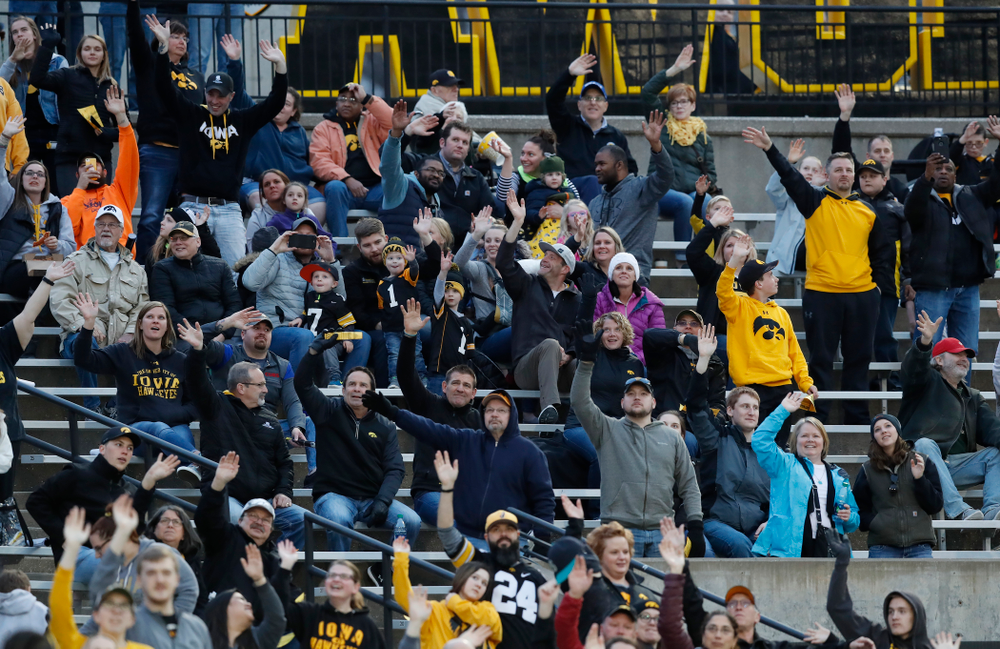 Fans wave to patients in the Stead Family Children's Hospital during Iowa Football's final spring practice Friday, April 20, 2018 at Kinnick Stadium. (Brian Ray/hawkeyesports.com)