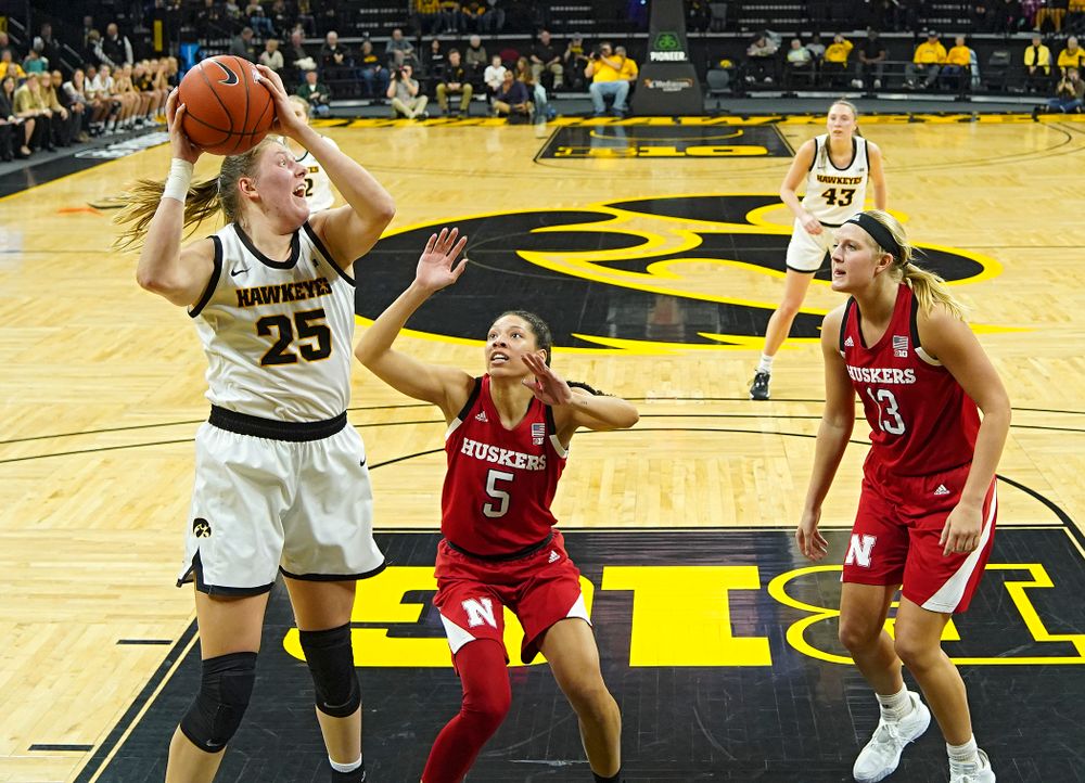 Iowa Hawkeyes forward Monika Czinano (25) pulls down a rebound during the second quarter of the game at Carver-Hawkeye Arena in Iowa City on Thursday, February 6, 2020. (Stephen Mally/hawkeyesports.com)