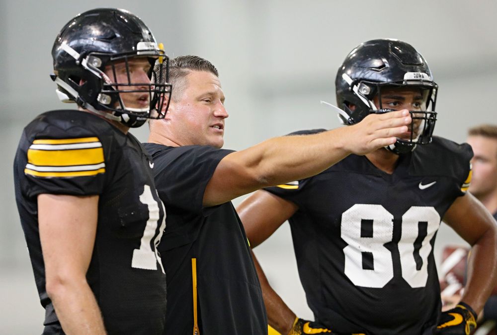 Iowa Hawkeyes offensive coordinator Brian Ferentz (center) talks with tight end Drew Cook (left) and tight end Josiah Miamen (right) during Fall Camp Practice No. 6 at the Hansen Football Performance Center in Iowa City on Thursday, Aug 8, 2019. (Stephen Mally/hawkeyesports.com)