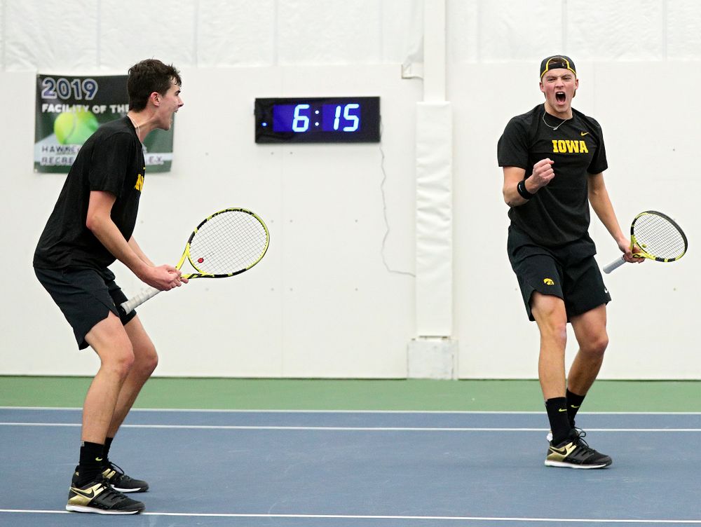 Iowa’s Matt Clegg (from left) and Joe Tyler celebrate a point during their doubles match at the Hawkeye Tennis and Recreation Complex in Iowa City on Friday, February 14, 2020. (Stephen Mally/hawkeyesports.com)