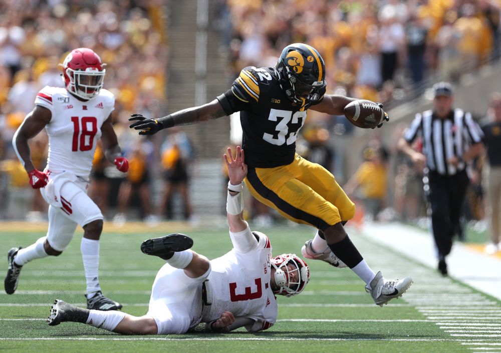 Iowa Hawkeyes linebacker Djimon Colbert (32) returns and interception against the Rutgers Scarlet Knights Saturday, September 7, 2019 at Kinnick Stadium. (Brian Ray/hawkeyesports.com)