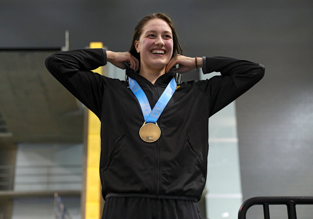 Iowa’s Hannah Burvill on the awards stand after placing third in the women’s 200 yard freestyle final event during the 2020 Women’s Big Ten Swimming and Diving Championships at the Campus Recreation and Wellness Center in Iowa City on Friday, February 21, 2020. (Stephen Mally/hawkeyesports.com)
