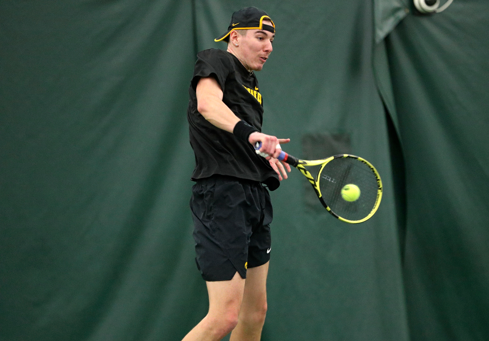 Iowa’s Nikita Snezhko returns a shot during his singles match at the Hawkeye Tennis and Recreation Complex in Iowa City on Friday, February 14, 2020. (Stephen Mally/hawkeyesports.com)