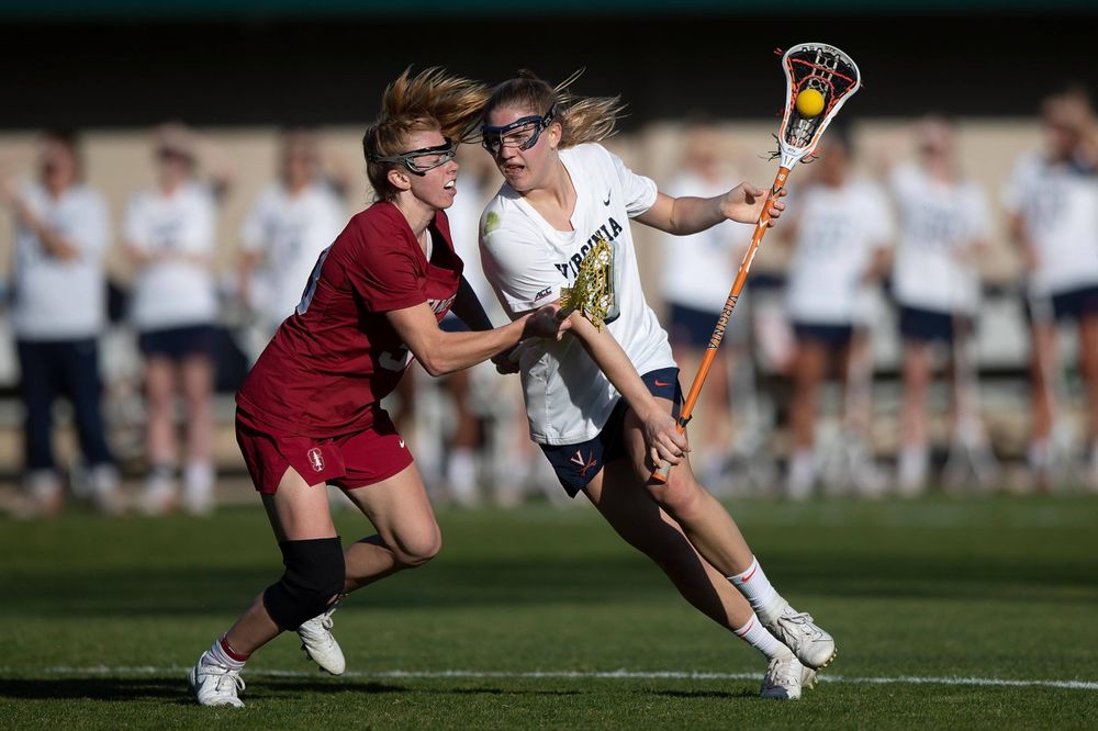STANFORD, California - FEBRUARY 14: Virginia Cavaliers midfield Sammy Mueller (2) is defended by Stanford Cardinal midfield Jacie Lemos (33) during the first half at Cagan Stadium on February 14, 2020 in Stanford, California. The Virginia Cavaliers defeated the Stanford Cardinal 12-11. (Photo by Jason O. Watson)