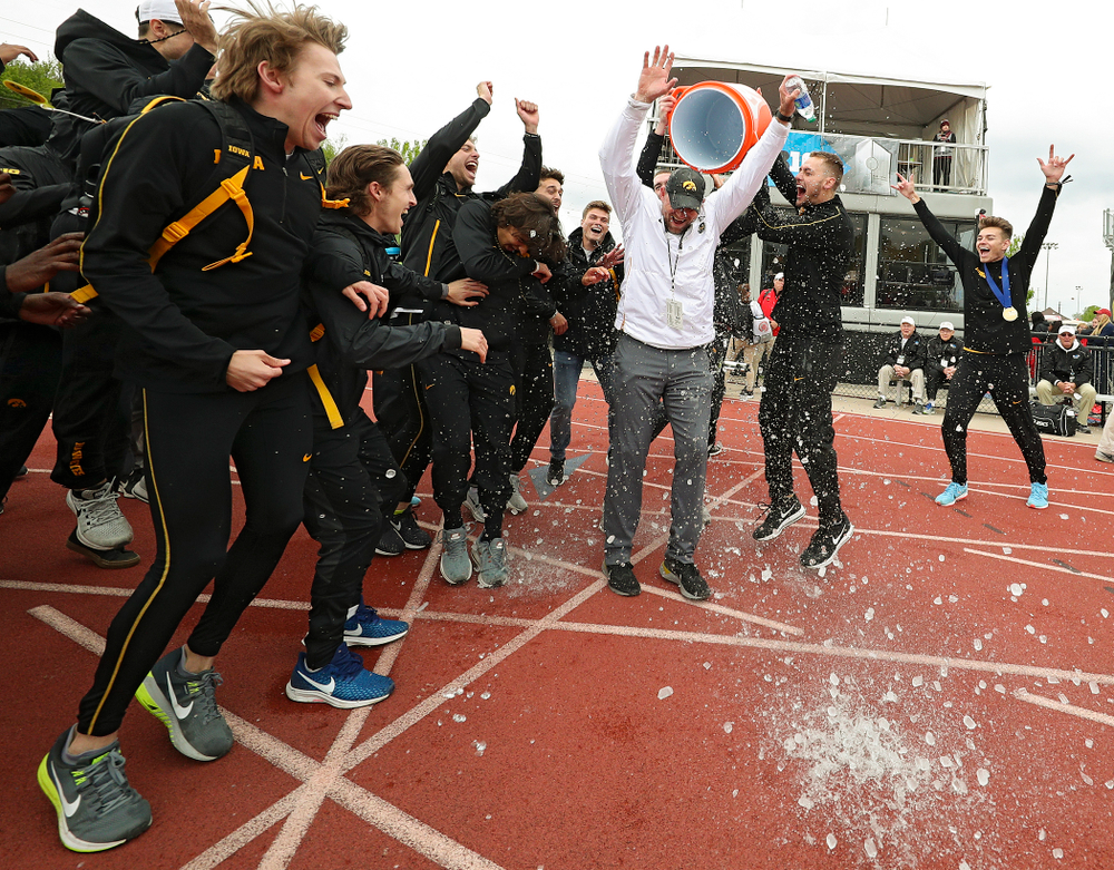 Iowa Director of Track and Field Joey Woody gets a Gatorade shower after winning the Men's Big Ten Outdoor Track and Field Championships on the third day of the Big Ten Outdoor Track and Field Championships at Francis X. Cretzmeyer Track in Iowa City on Sunday, May. 12, 2019. (Stephen Mally/hawkeyesports.com)