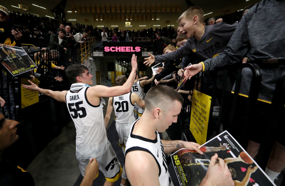 Iowa Hawkeyes forward Luka Garza (55) celebrates with fans following their win against the Maryland Terrapins Friday, January 10, 2020 at Carver-Hawkeye Arena. (Brian Ray/hawkeyesports.com)