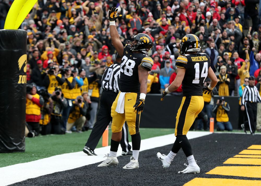 Iowa Hawkeyes running back Toren Young (28) blows a kiss to the fans after scoring against the Nebraska Cornhuskers Friday, November 23, 2018 at Kinnick Stadium. (Brian Ray/hawkeyesports.com)