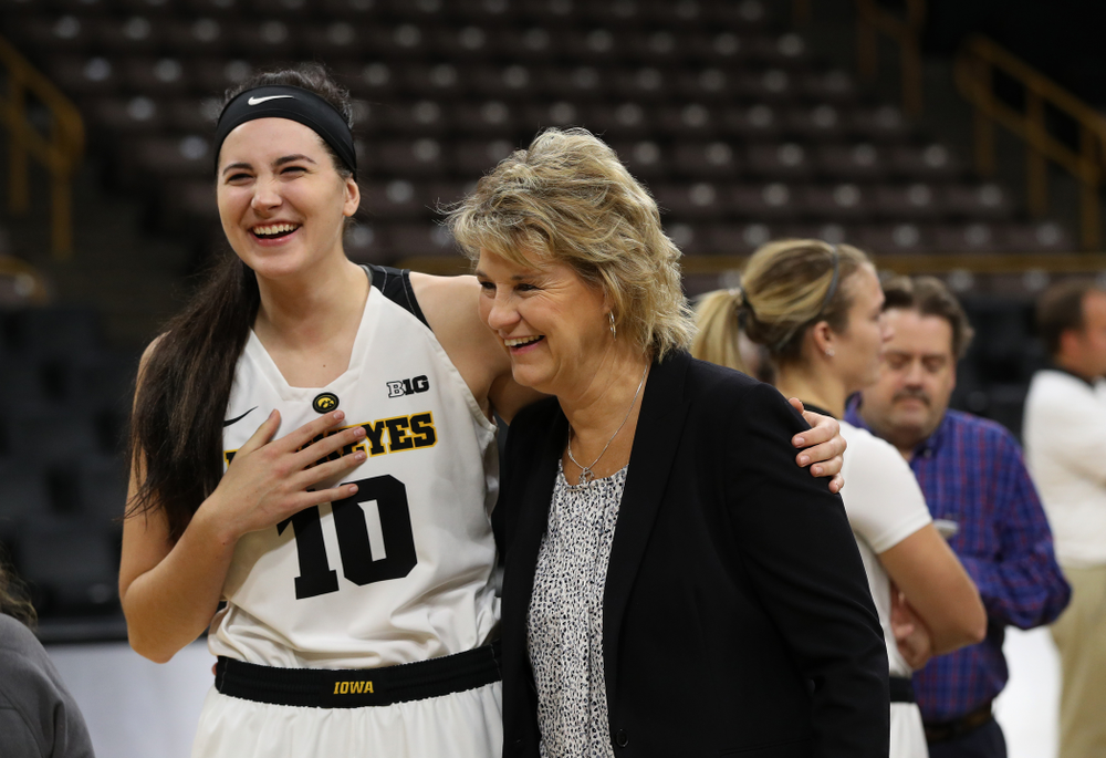 Iowa Hawkeyes forward Megan Gustafson (10) laughs with head coach Lisa Bluder during the team's annual media day Wednesday, October 31, 2018 at Carver-Hawkeye Arena. (Brian Ray/hawkeyesports.com)