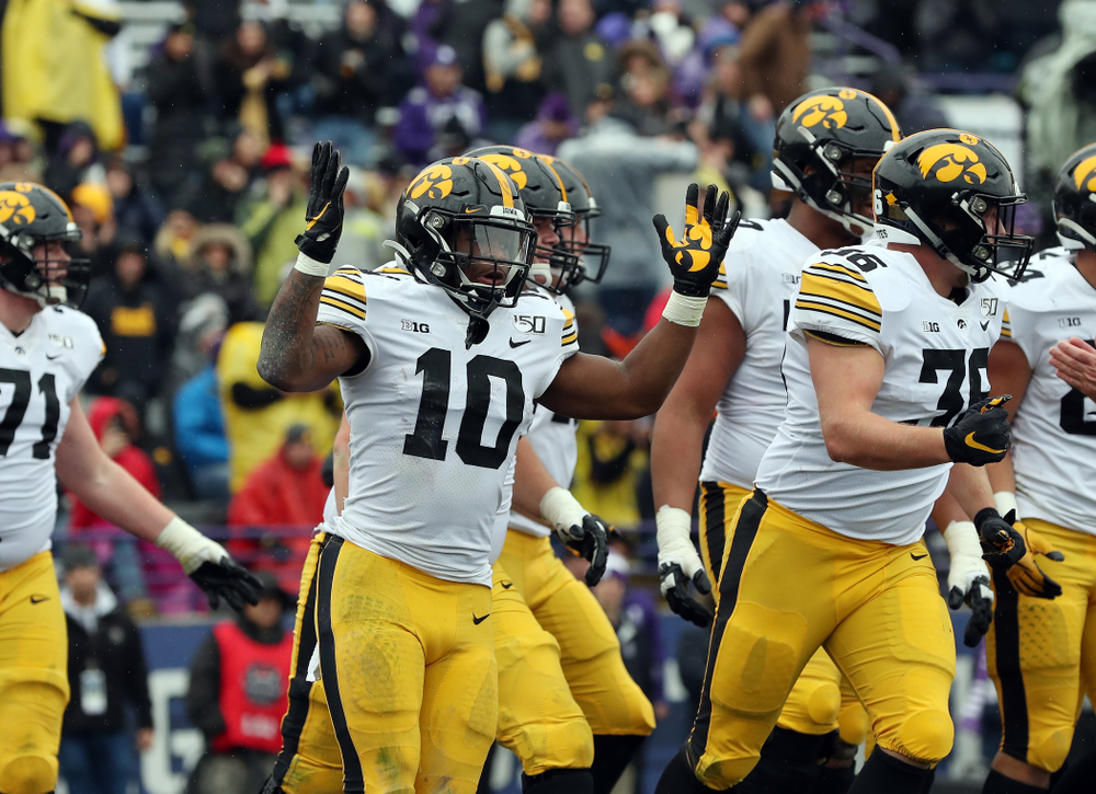 Iowa Hawkeyes running back Mekhi Sargent (10) celebrates a touchdown against the Northwestern Wildcats Saturday, October 26, 2019 at Ryan Field in Evanston, Ill. (Brian Ray/hawkeyesports.com)