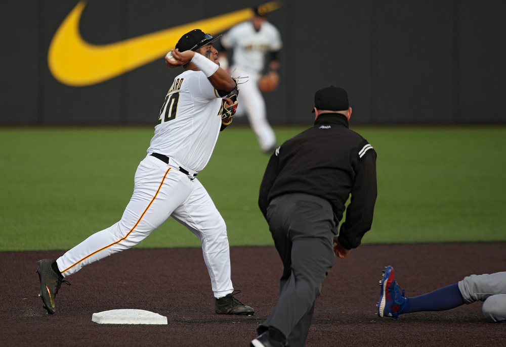 Iowa infielder Izaya Fullard (20) throws to first base as they turn a double play during the eighth inning of their college baseball game at Duane Banks Field in Iowa City on Wednesday, March 11, 2020. (Stephen Mally/hawkeyesports.com)