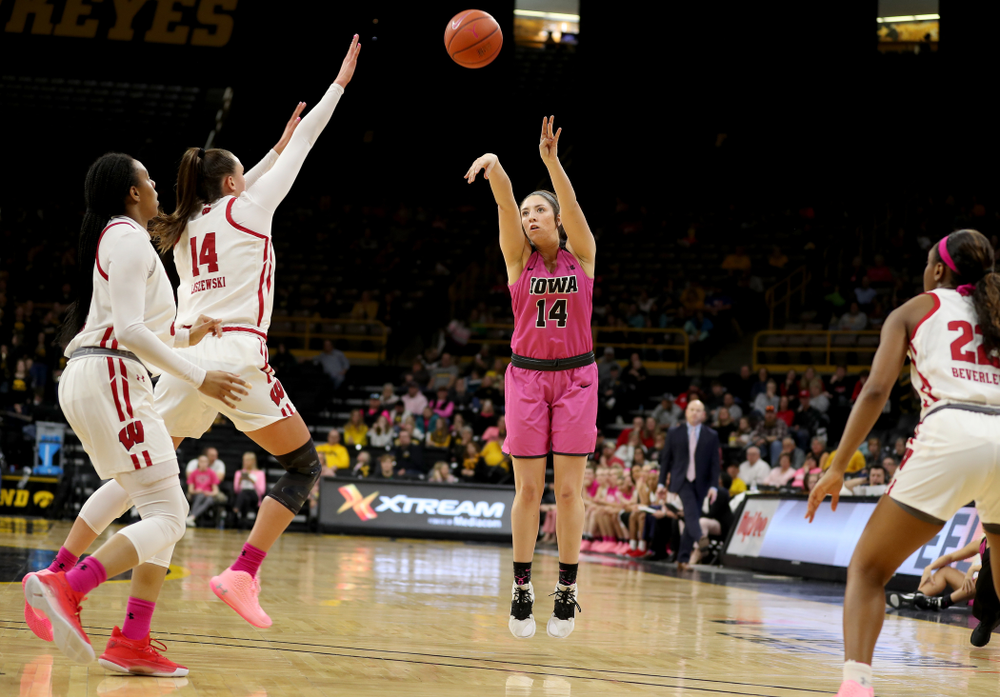 Iowa Hawkeyes forward McKenna Warnock (14) knocks down a three point basket against the Wisconsin Badgers Sunday, February 16, 2020 at Carver-Hawkeye Arena. (Brian Ray/hawkeyesports.com)