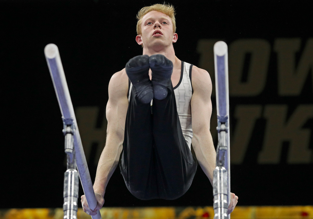 Iowa's Nick Merryman competes in the parallel bars during the second day of the Big Ten Men's Gymnastics Championships at Carver-Hawkeye Arena in Iowa City on Saturday, Apr. 6, 2019. (Stephen Mally/hawkeyesports.com)